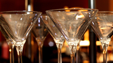 cocktail glasses on a bar