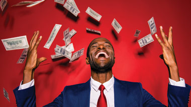 cash falling on a happy man