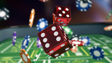 dice and chips falling on a table
